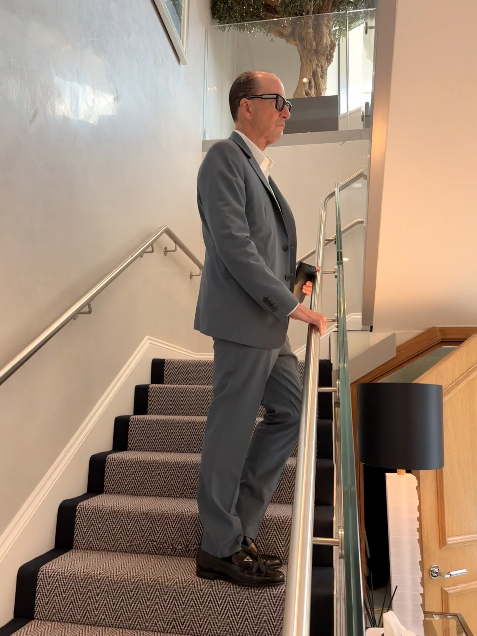 Mark Dyer Property: Mark Dyer on the staircase of a London show home